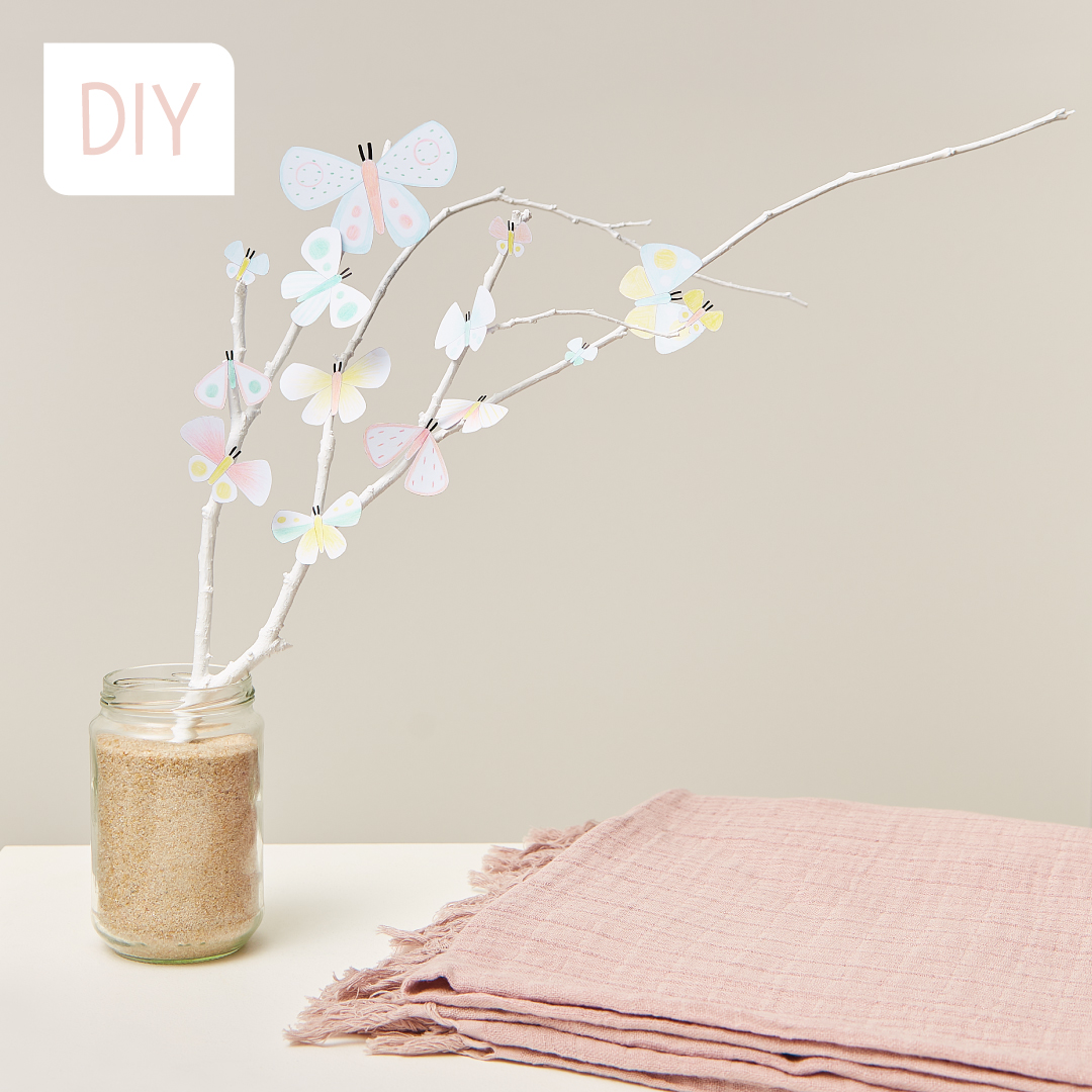 A pretty spring decoration to make by sticking butterflies on a branch!