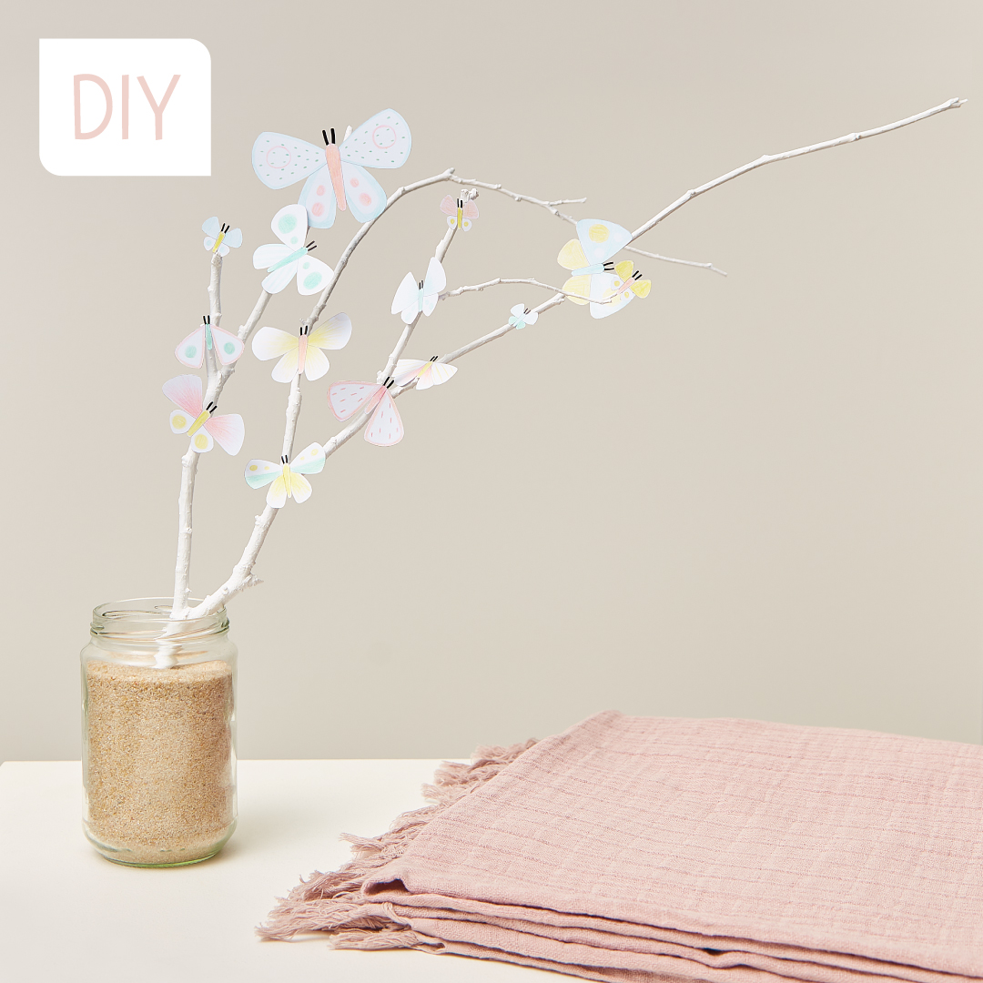 A pretty spring decoration to make by sticking butterflies on a branch!